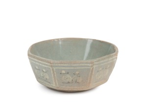 An antique Korean octagonal celadon bowl adorned with white and black slip decorated chrysanthemums, Koryo Dynasty, 12th/13th century, ​​​​​​​4cm high, 11.5cm wide.