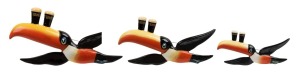 CARLTON WARE "My Goodness - My Guinness" set of three graduated flying toucan wall ornaments, black factory marks to reverse, the largest 25cm long.