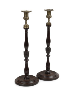 A fine pair of antique treen candlesticks with brass tops, 19th century, ​​​​​​​40cm high.