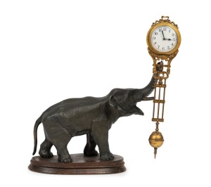 JUNGHANS Mystery swinging clock with spelter elephant base, early 20th century, ​​​​​​​28cm high.