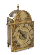 A rare antique English miniature travelling lantern alarm clock circa 1770. Break arch brass dial engraved "THO. PRATT TOWCESTER". Roman numeral engraved chaptering. Floral engraved dial centre with alarm disc and blued steel single hand. Weight driven mo