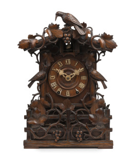 JOHANN BAPTISTE BEHA fine quality antique German Black Forest cuckoo spring table clock, circa 1890. The chalet style walnut case with well carved vine leaf, grape and cuckoo bird decoration. Well carved bone hands with applied Roman numerals to the dial.