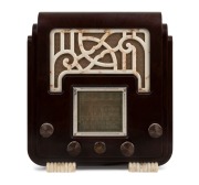 A.W.A. THE FISK RADIOLETTE "Fret and Feet" mantle radio in brown and cappuccino bakelite, 33cm high.