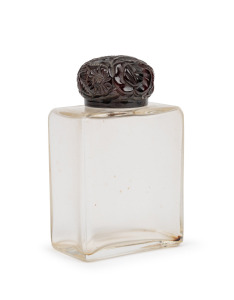 French glass perfume bottle with floral bakelite top, circa 1920s, ​​​​​​​9.5cm high.
