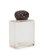 French glass perfume bottle with floral bakelite top, circa 1920s, ​​​​​​​9.5cm high.