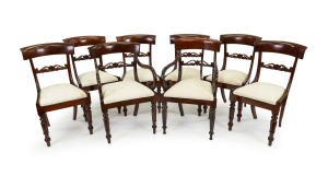 A set of eight spade back William IV mahogany dining chairs with scroll carved back splat and drop-in seats, circa 1845. Note: One carver of differing design but of the correct period.