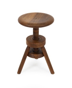A vintage industrial style revolving timber stool, crafted in beech, 20th century, 50 cm high, 30cm diameter