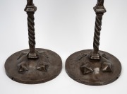 A pair of Arts and Crafts wrought iron candlesticks, 20th century, 48cm high. - 2