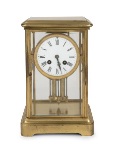 An antique French four glass library clock in polished brass and lacquered case, one piece enamel dial with Roman numerals, eight day time and gong striking movement, circa 1900, ​​​​​​​28cm high.