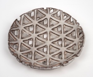 ALESSIO TASCA Italian pierced pottery dish, mid 20th century, impressed mark to base and bearing original paper label, 25cm wide.