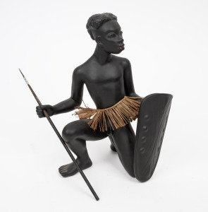 GMUNDNER KERAMIK Austrian figural pottery statue of a kneeling African warrior with metal spear, mid 20th century, original foil label to base, 27cm high.