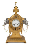 An antique French figural mantle clock in a fine quality engraved gilt ormolu case with silver plated elephant mounts to the side and agate cabochon decoration, enamel dial with Roman numerals and breguet style hands. Time and bell striking eight day move