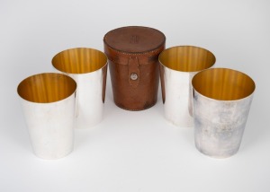 ASPREY & Co. of London fine quality set of four silver plated beakers with gilt wash interiors, housed in original leather campaign case, 19th/20th century, 10cm high.