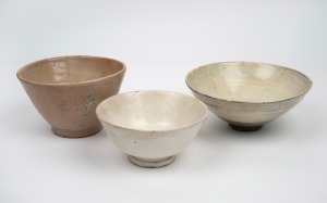 Three antique Korean stoneware bowls, Choson Dynasty, 17th/18th century, the largest 18cm diameter.
