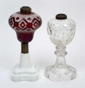 BACCARAT antique French blown crystal oil lamp base (iridescent under black light); together with an antique oil lamp with milk glass base and ruby glass font, most likely American, 19th century, (2 items), 23cm and 26cm high.