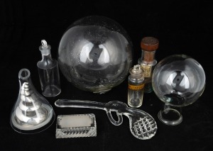 Chemist jars, stamp roller, wine funnel, glass buoy and pistol ornament, 19th and 20th century, (8 items), the buoy 18cm diameter.