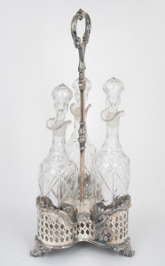An antique silver plated decanter stand with matching set of three cut crystal decanters, 19th century, 48cm high overall.