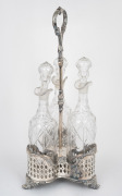 An antique silver plated decanter stand with matching set of three cut crystal decanters, 19th century, 48cm high overall.