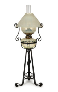 WHITEFRIARS "EIFFEL" antique vaseline glass oil lamp with original shade and reflector, on original wrought iron stand, late 19th century, 80cm high overall.