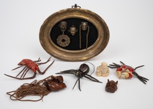 Japanese carved boxwood netsuke; together with a carved bone netsuke, vintage Japanese fishing lures and a framed Japanese miniature face mask display, 20th century, (qty).