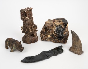 An antique Chinese carved wooden statue with polychrome finish; together with a carved Chinese dagger, a natural amber specimen, a bronze hippopotamus statue and a carved stone tooth ornament, mixed vintages and origins, (5 items), ​​​​​​​the statue 18cm 