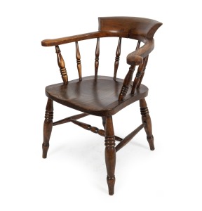 An antique English elm captain's chair, 19th century, 65cm across the arms.
