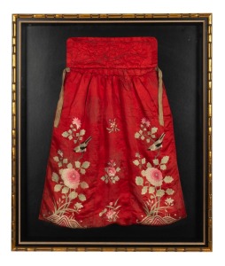 An antique Sino-Mongolian magician's garment in red silk with embroidered birds and flowers, attractively displayed in box frame, 19th century. 90 x 76cm overall.