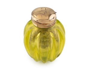 A rare antique vinaigrette in uranium glass with 15ct gold top and grill, early to mid 19th century, 3.5cm high.