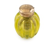 A rare antique vinaigrette in uranium glass with 15ct gold top and grill, early to mid 19th century, 3.5cm high.