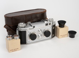 JULES RICHARD: 1955-type Verascope f40 stereo camera [#3758121] with twin Som Berthiot Flor 40mm f3.5 lenses [#1077924 & #1078037], two lens caps, and leather case, together with two UV lens filters and two lens hoods in Jules Richard Paris maker's boxes.