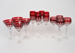 WATERFORD suite of twelve ruby overlay cut crystal glasses, comprising of four red wine, four champagne and four martini glasses, (12 items), acid etched mark to base "Waterford", the largest 25cm high.