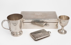 A sterling silver christening mug, eggcup, cigarette case and cigarette box (585 grams including cedar lining), 19th and 20th century, (4 items), 823 grams total including box with cedar lining.