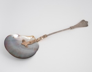 An antique silver and pearl shell serving spoon with engraved decoration and remains of gilt finish, possibly Russian, 19th century, stamped "G.H. 935", ​​​​​​​25cm long,54 grams total including shell.