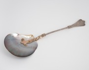 An antique silver and pearl shell serving spoon with engraved decoration and remains of gilt finish, possibly Russian, 19th century, stamped "G.H. 935", ​​​​​​​25cm long,54 grams total including shell.