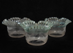 Three antique blue and clear glass lightshades with fern etched decoration, 13cm high, 22cm wide, the base aperture 10.5cm diameter.