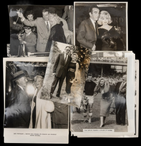 MARILYN MONROE: Collection of nineteen original black and white photographs, mostly press photographs, including shots of Monroe with her husbands Arthur Miller and Joe DiMaggio, meeting Queen Elizabeth II, at sporting events, etc. (19 items)