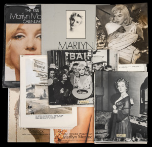 MARILYN MONROE: Collection of eight press photographs, mostly 20 x 16cm, all with views taken during the period following Monroe's 1962 death, together with twenty black and white publicity stills from several of her films, and four other items including 