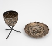 An antique Chinese export silver dish with dragon decoration together with a Japanese export silver eggcup with bamboo decoration, 19th/20th century, the dish 8.5cm wide, 106 grams total