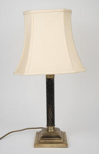A brass based table lamp with Corinthian column capital and later shade, 59cm high overall.