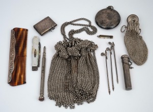 Antique sterling silver vesta, sterling silver powder compact, sterling silver and mother of pearl pen knife, miniature novelty mother of pearl pen knife, sterling silver mounted comb, three sterling silver cocktail skewers, a sterling silver needle case and two silver plated coin purses, 19th and 20th century, (12 items).