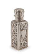 An antique English sterling silver square form scent bottle with chased and engraved floral decoration, housed in original fitted box, manufactured by Arthur Pennington of Birmingham, circa 1892, 7.5cm high.