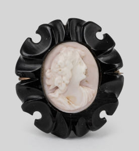 An antique cameo brooch in carved jet surround, mounted in 9ct rose gold, 19th century, 4cm high overall.