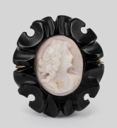 An antique cameo brooch in carved jet surround, mounted in 9ct rose gold, 19th century, 4cm high overall.