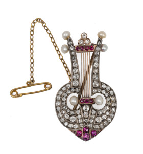 A fine quality antique 9ct rose gold lyre brooch adorned with rose cut diamonds, rubies and pearls set in sterling silver mount, 19th century, 4.2cm high, 7.8 grams.