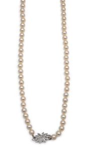 A fine quality cultured pearl necklace with 18ct white gold and diamond clasp, housed in a Hardy Brothers plush box, stamped "750", 75cm long