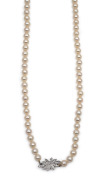 A fine quality cultured pearl necklace with 18ct white gold and diamond clasp, housed in a Hardy Brothers plush box, stamped "750", 75cm long