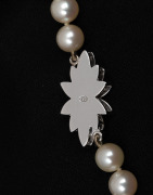 A fine quality cultured pearl necklace with 18ct white gold and diamond clasp, housed in a Hardy Brothers plush box, stamped "750", 75cm long - 3
