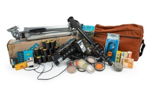 VARIOUS MANUFACTURERS: A canvas bag containing many camera accessories, including fourteen lens filters and more than twenty expired film products, plus Manfrotto monopod and Velbon tripod (in box).