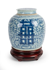 An antique Chinese blue and white porcelain ginger jar on later carved wooden stand, Qing Dynasty, 19th century, 29cm high overall.