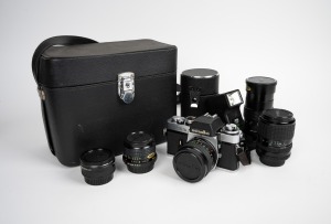 MINOLTA: 1975 XEb SLR camera with Minolta MC Rokkor-PG 50mm f1.4 lens and Minolta lens cap, offered in leather case with four additional lenses plus flash attachment.